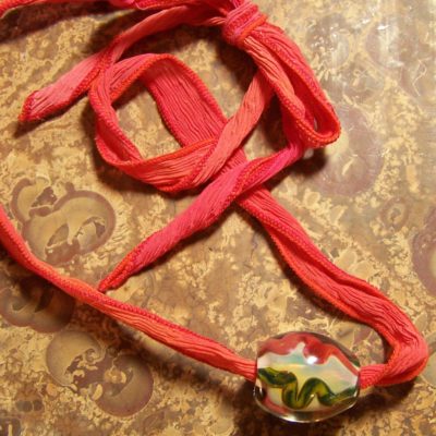 hand blown bead pendant on silk ribbon